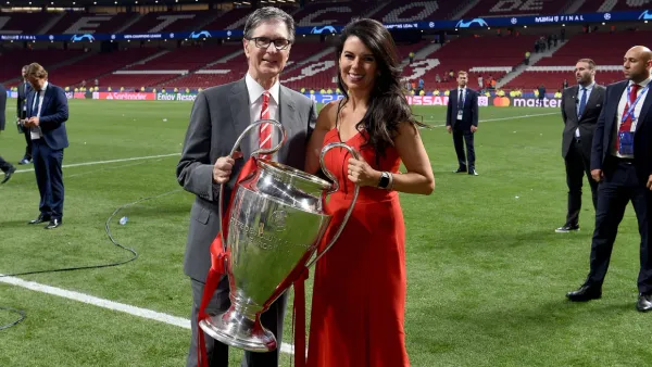 John Henry and Linda Pizzuti Henry holding Champions League trophy