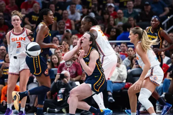 Caitlin Clark reacts to hard foul